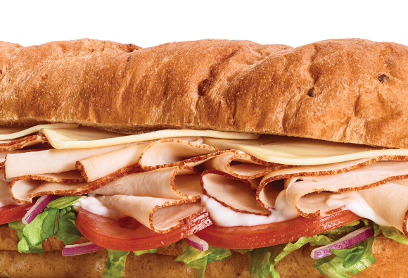 Closeup of an Oven-Roasted Turkey sub. Any Footlong for $6.99.